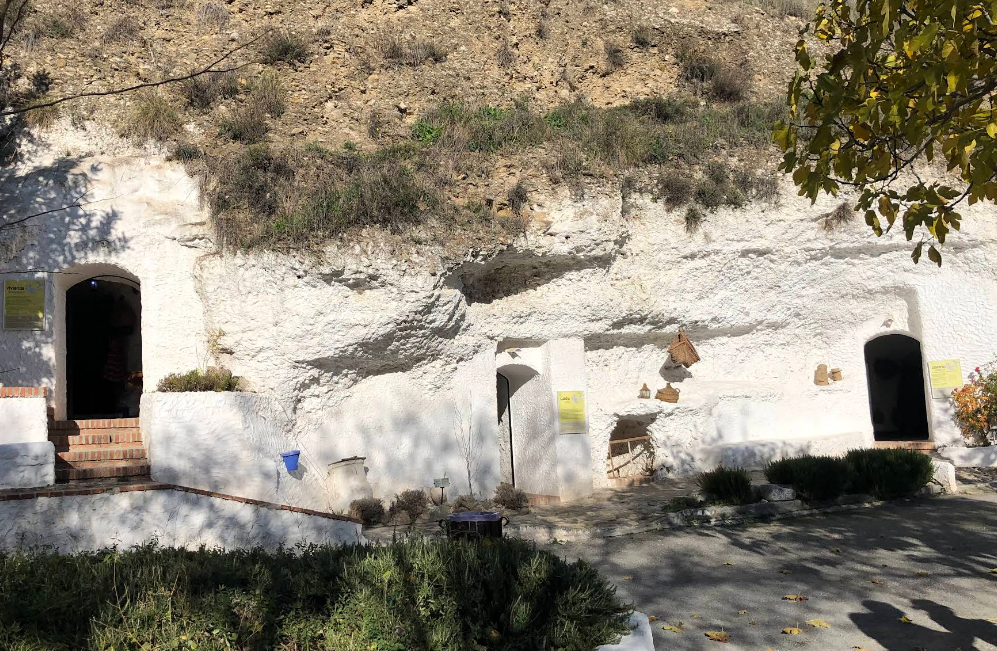 Whitewashed cave interior at Cuevas El Abanico in Sacromonte, Granada