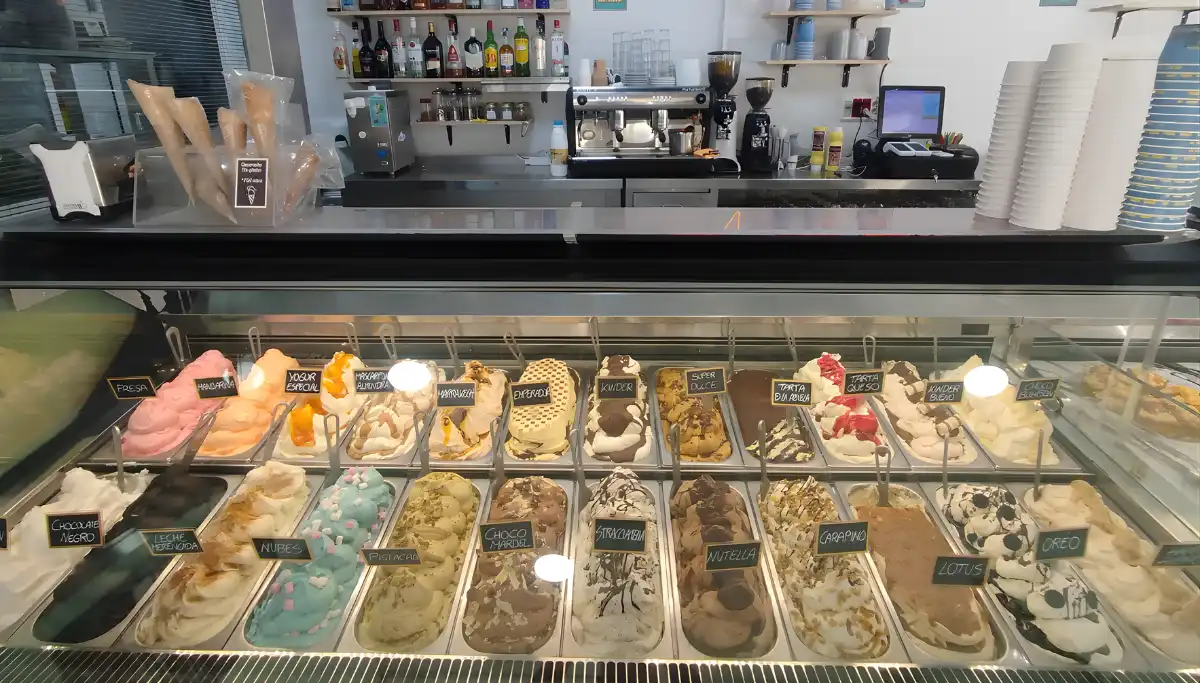 Rows of artisan gelato flavours in the display counter at Mardels in Malaga