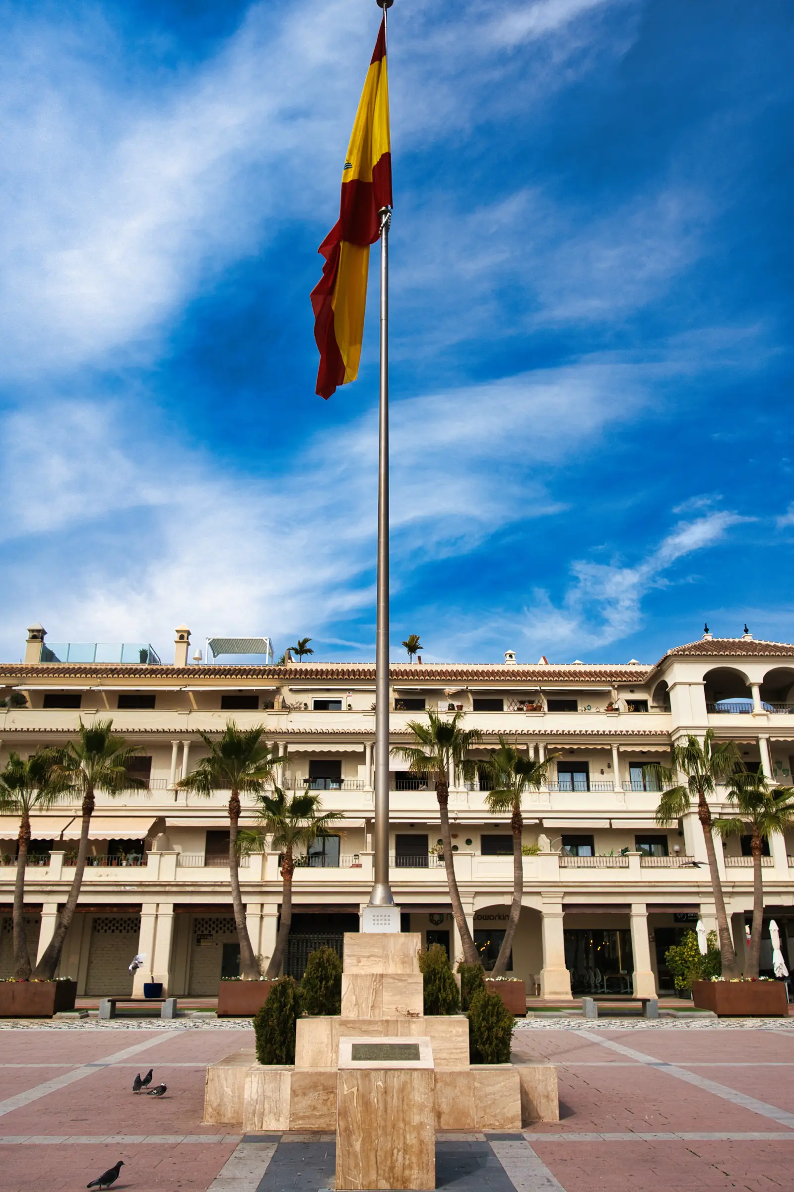 Plaza de España entrance with Spanish flag