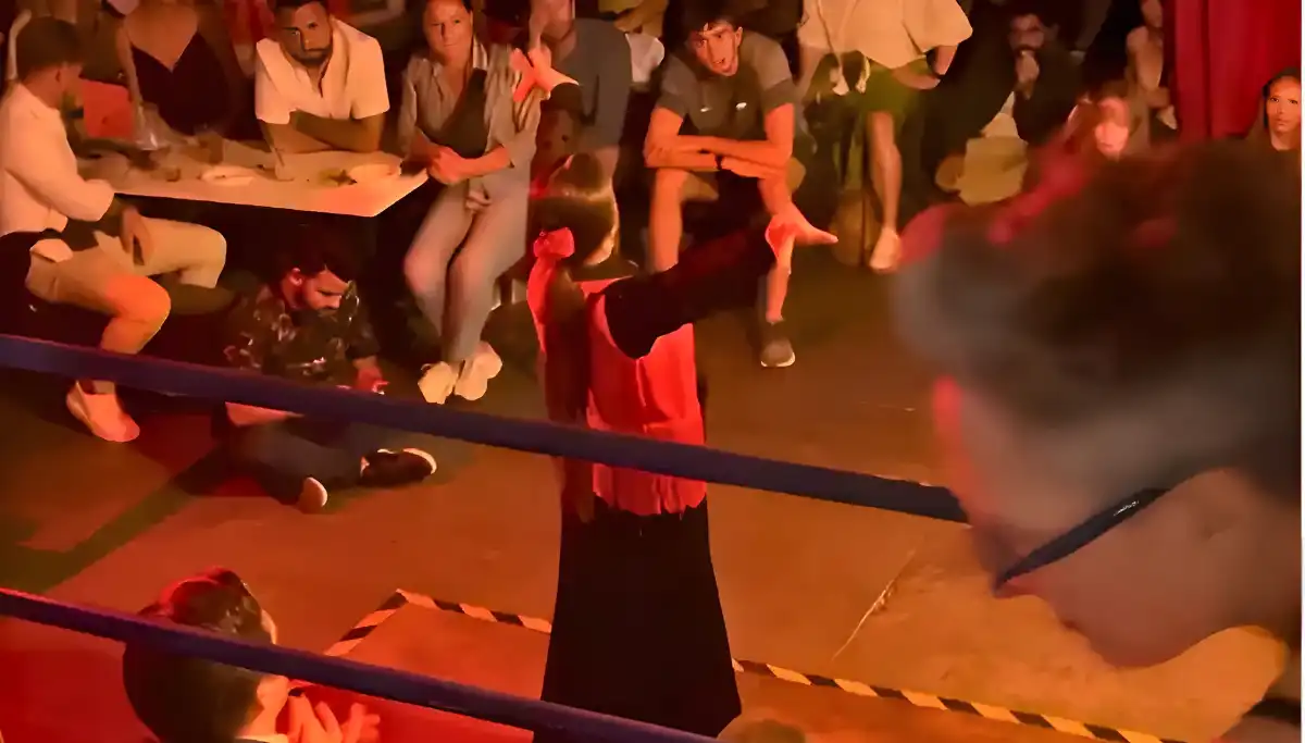 Flamenco dancer performing in a red dress at an intimate tablao in Seville