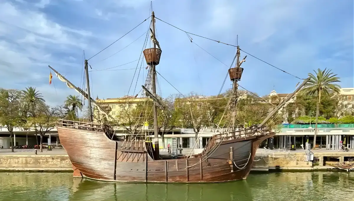 Historic wooden sailing ship moored on the Guadalquivir River in Seville