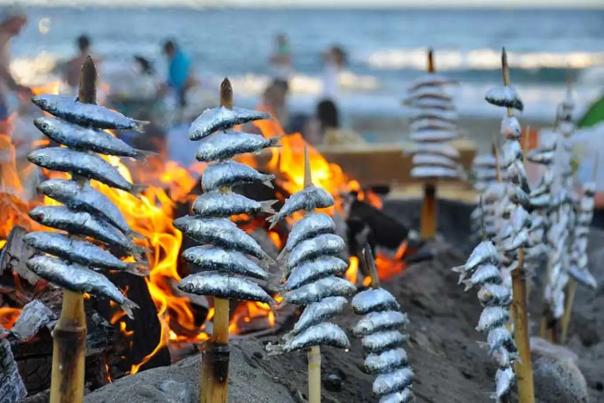 Espetos de sardinas grilled on the beach