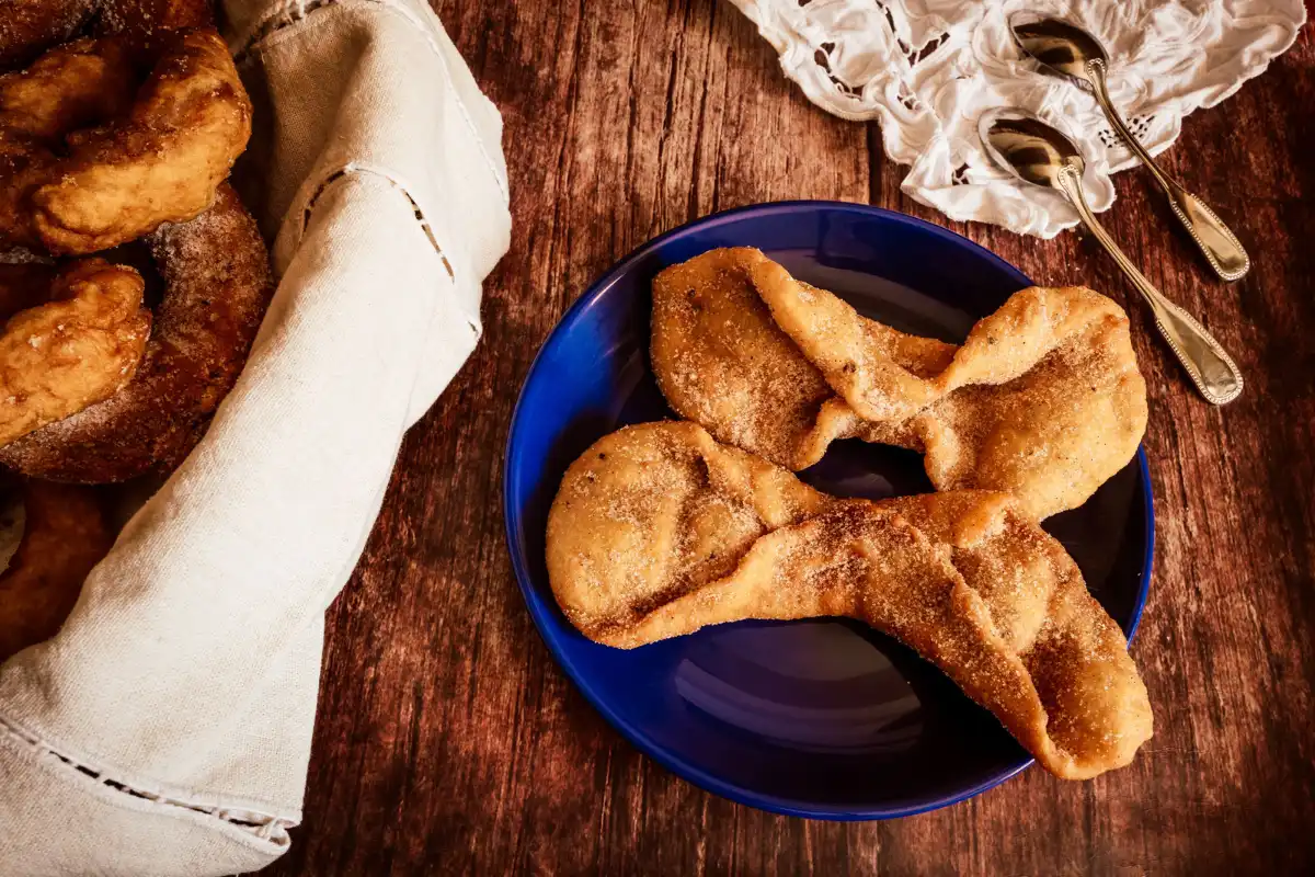 Pestinos, traditional honey-coated fried dough fritters