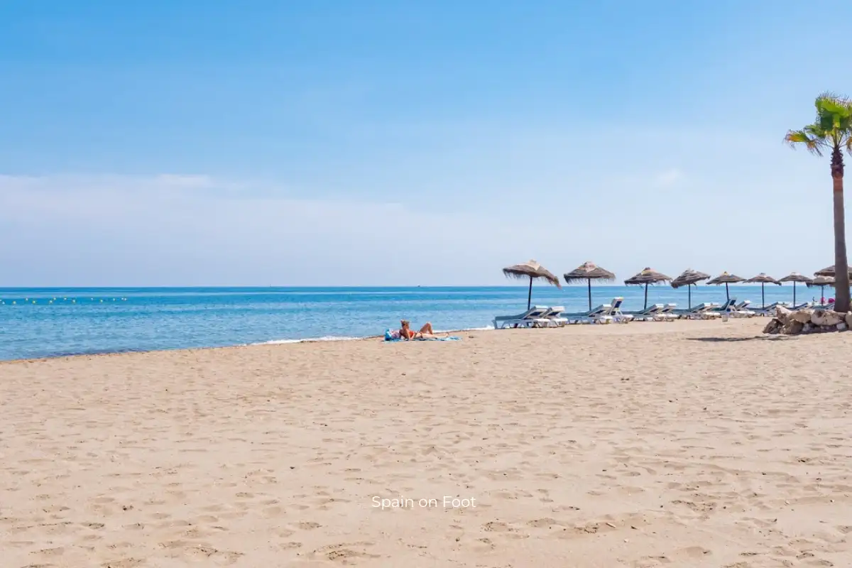 golden sand with a blue ocean and sky background at Playa de la Rada.