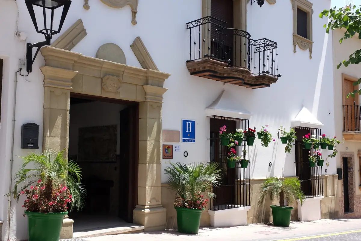 Entrance of boutique Hotel Casa Veracruz in Estepona framed by potted plants