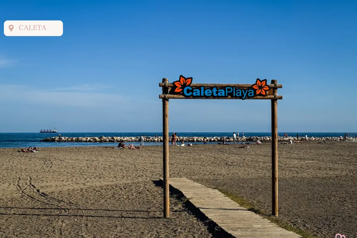 A walkway leading onto Playa Caleta beach.
