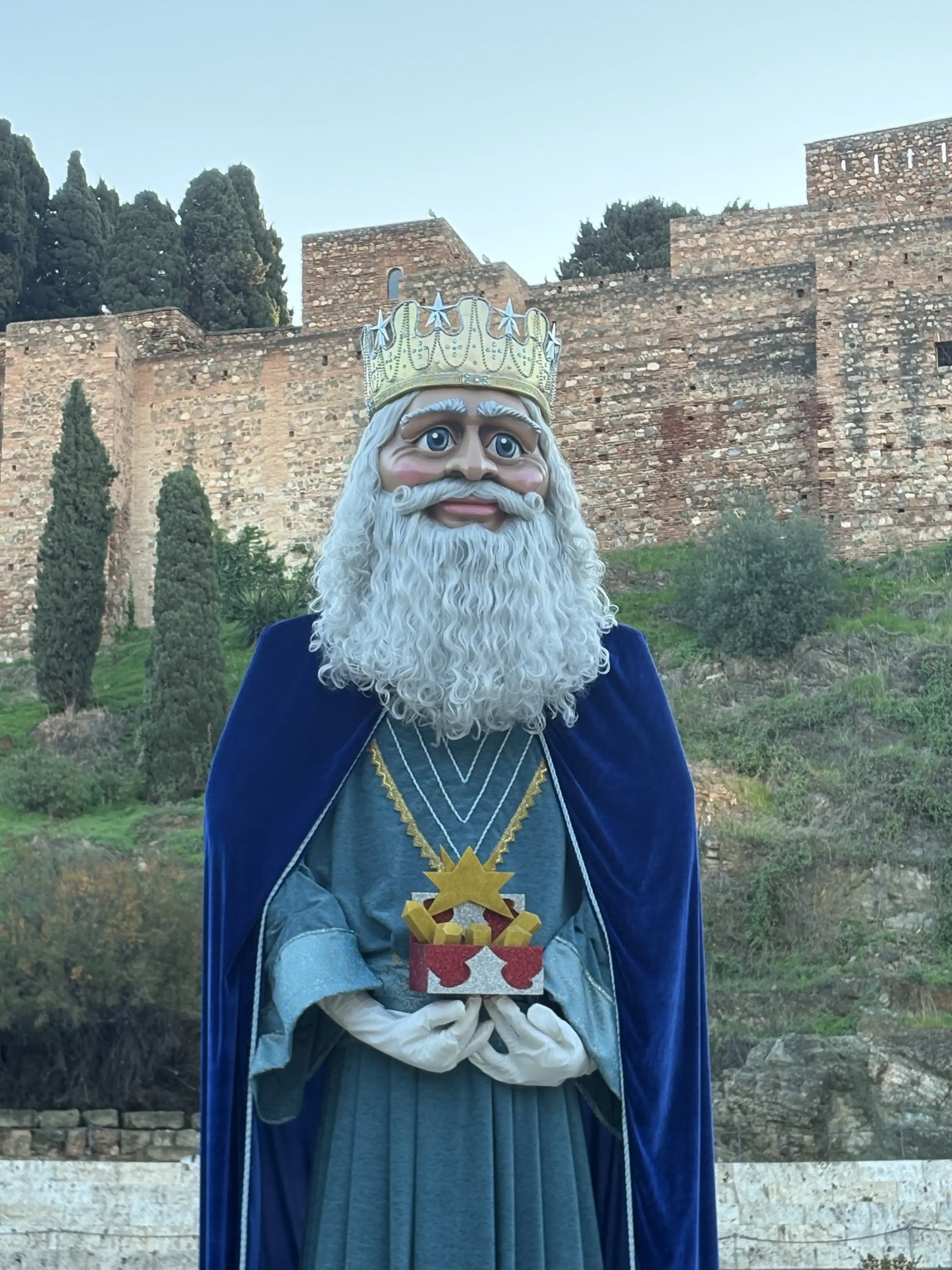 Float depicting a robed king during the Three Kings parade in Málaga