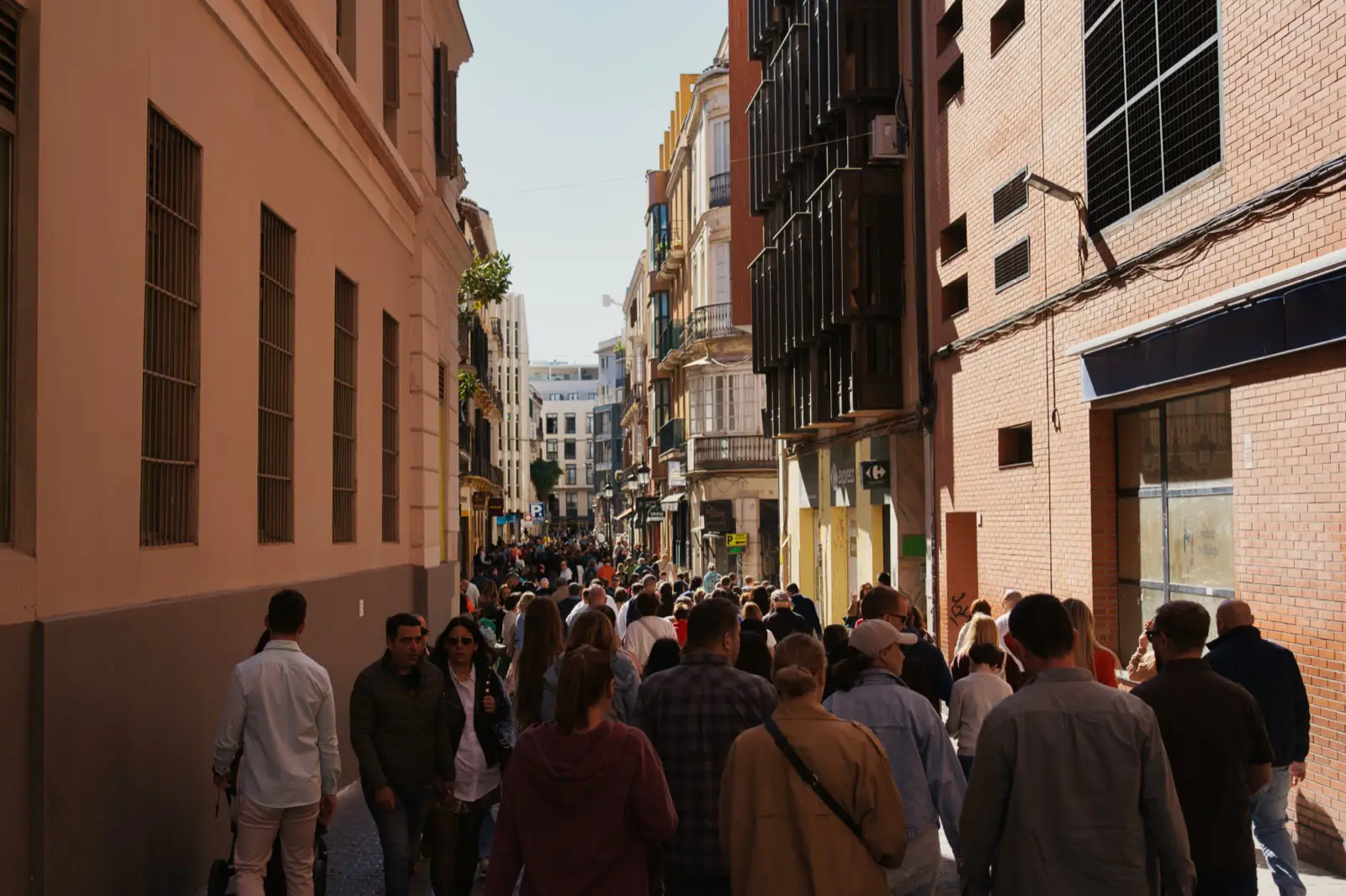 Packed street in Málaga during a Semana Santa Holy Week procession