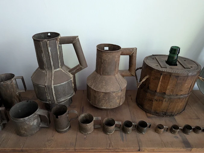 Wine barrels and antique tools inside the Malaga Wine Museum
