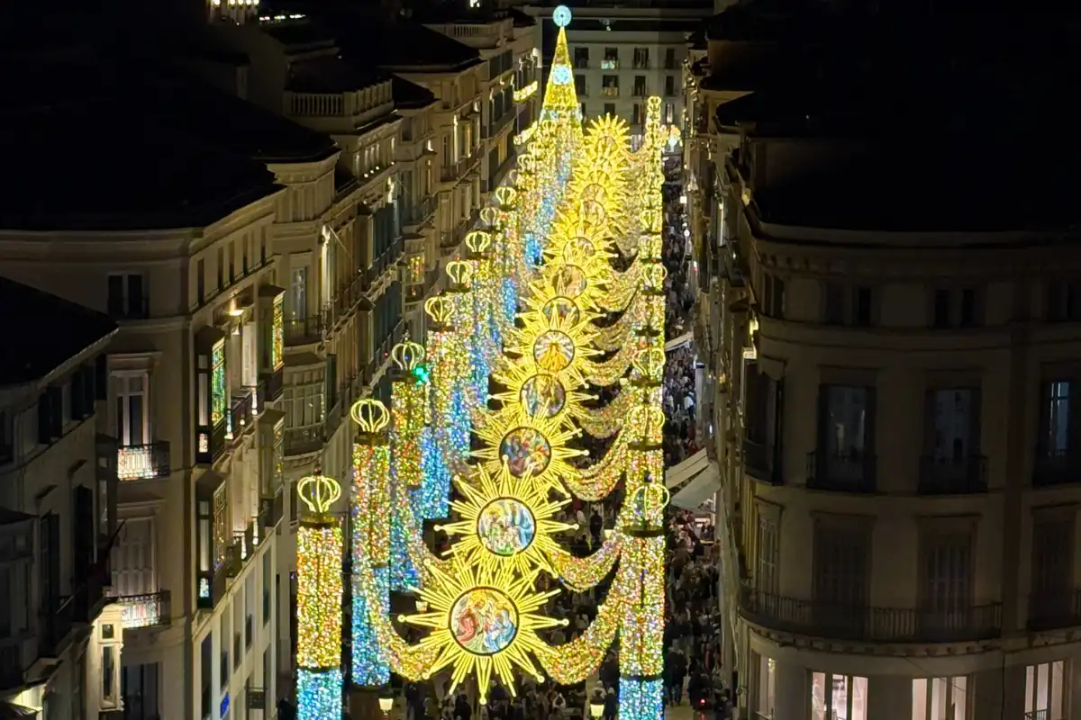 Christmas lights glowing over Malaga rooftops at night