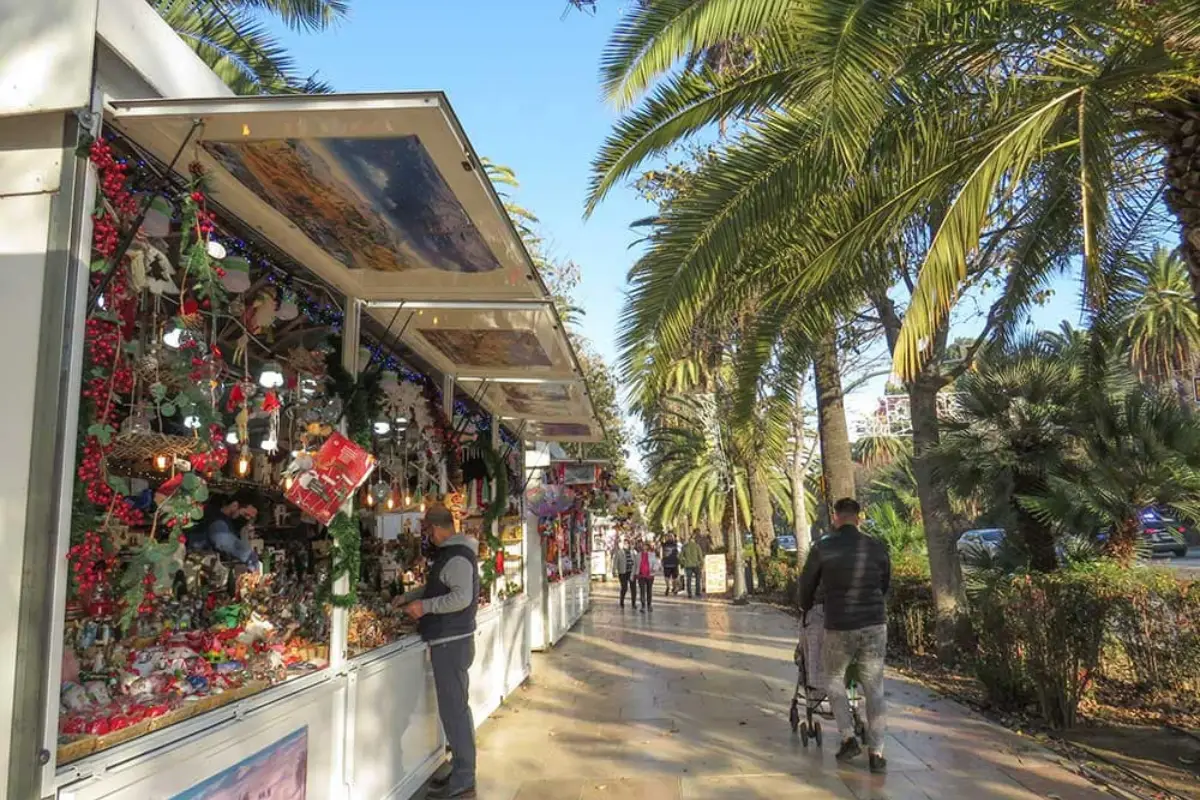 Market stalls along the seafront walkway in Malaga during the Christmas season