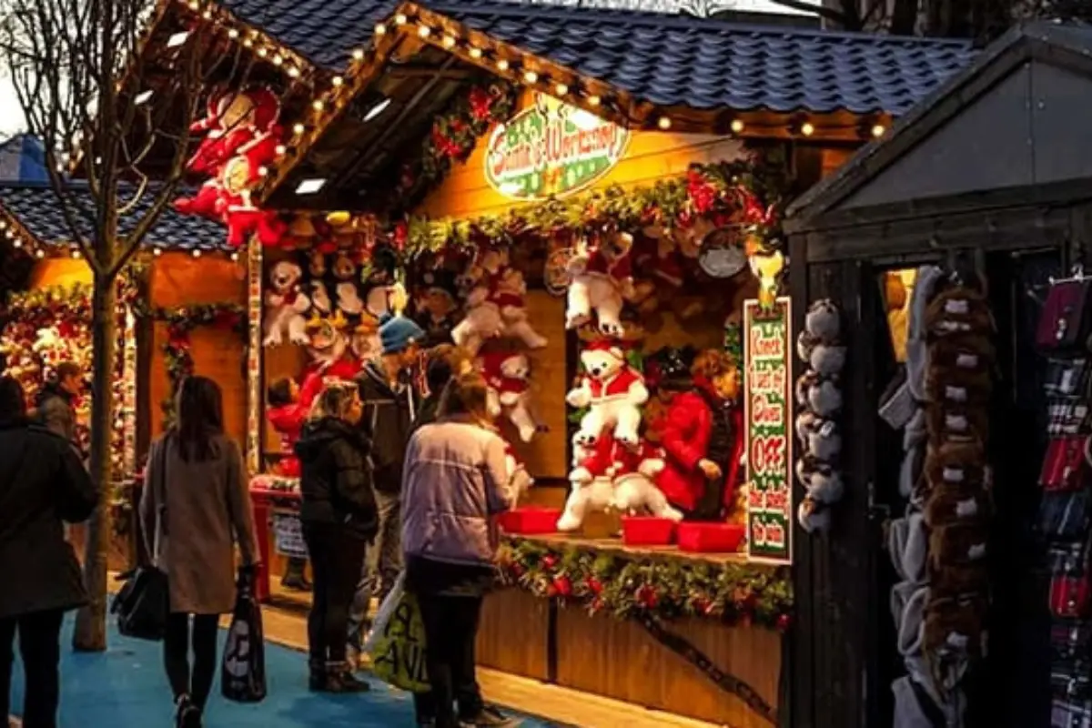 Shoppers at a toy stall in the Malaga Christmas market