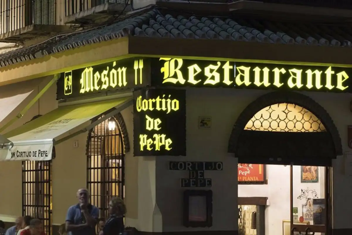 Neon Mesón Restaurante sign at Cortijo de Pepe on Plaza de la Merced, Málaga