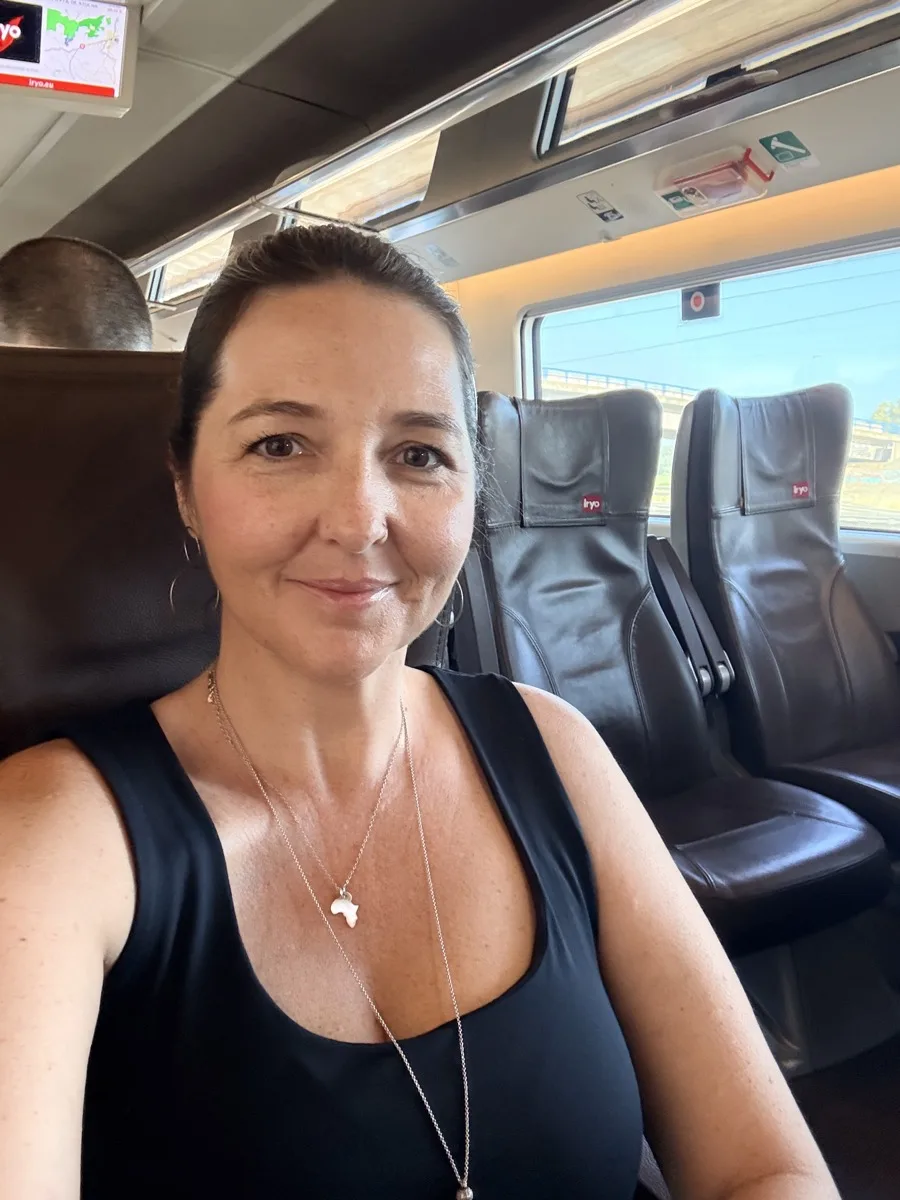 Heidi taking a selfie on a train seat in Spain