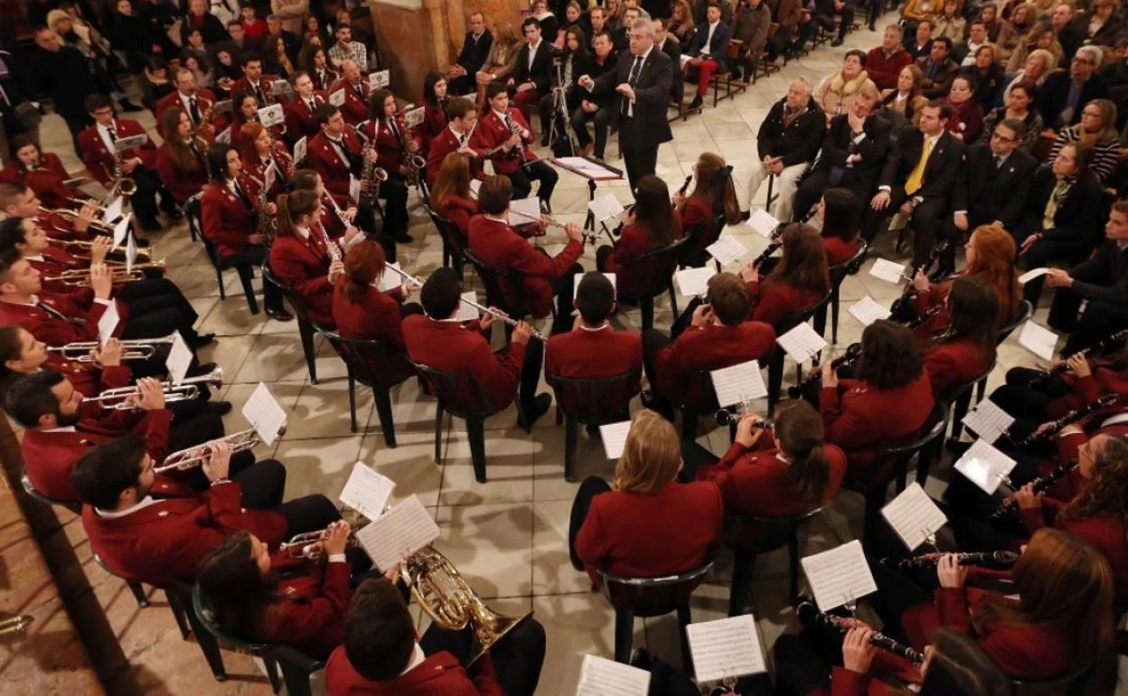 Malaga Municipal Band performing a free Christmas concert in a packed hall