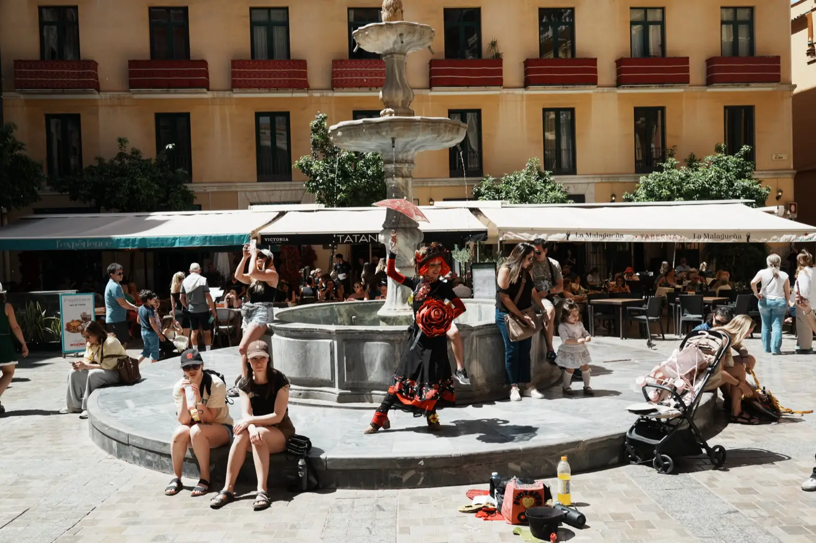 Costumed street performer entertaining a crowd in Málaga's old town