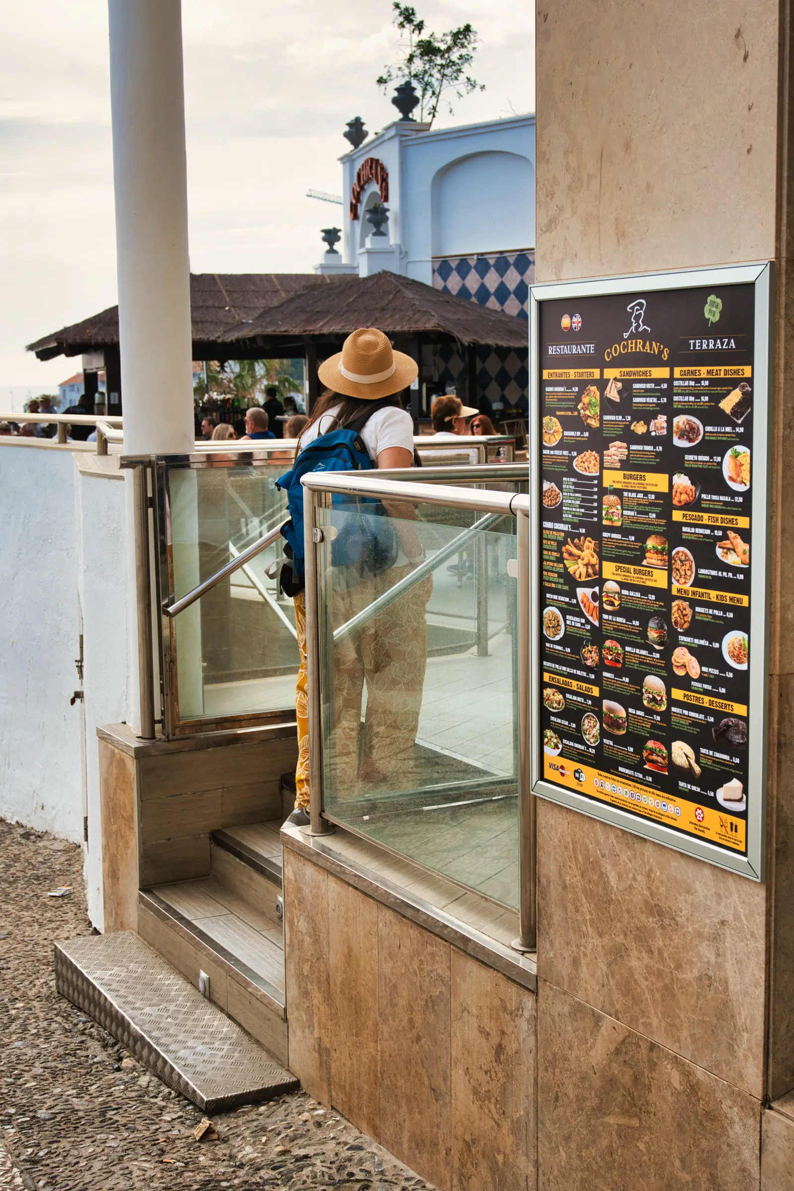 Heidi waking into a resturant in Nerja
