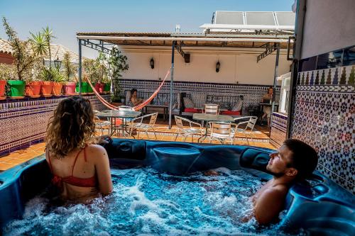 Bright communal area at Triana Backpackers hostel in Seville