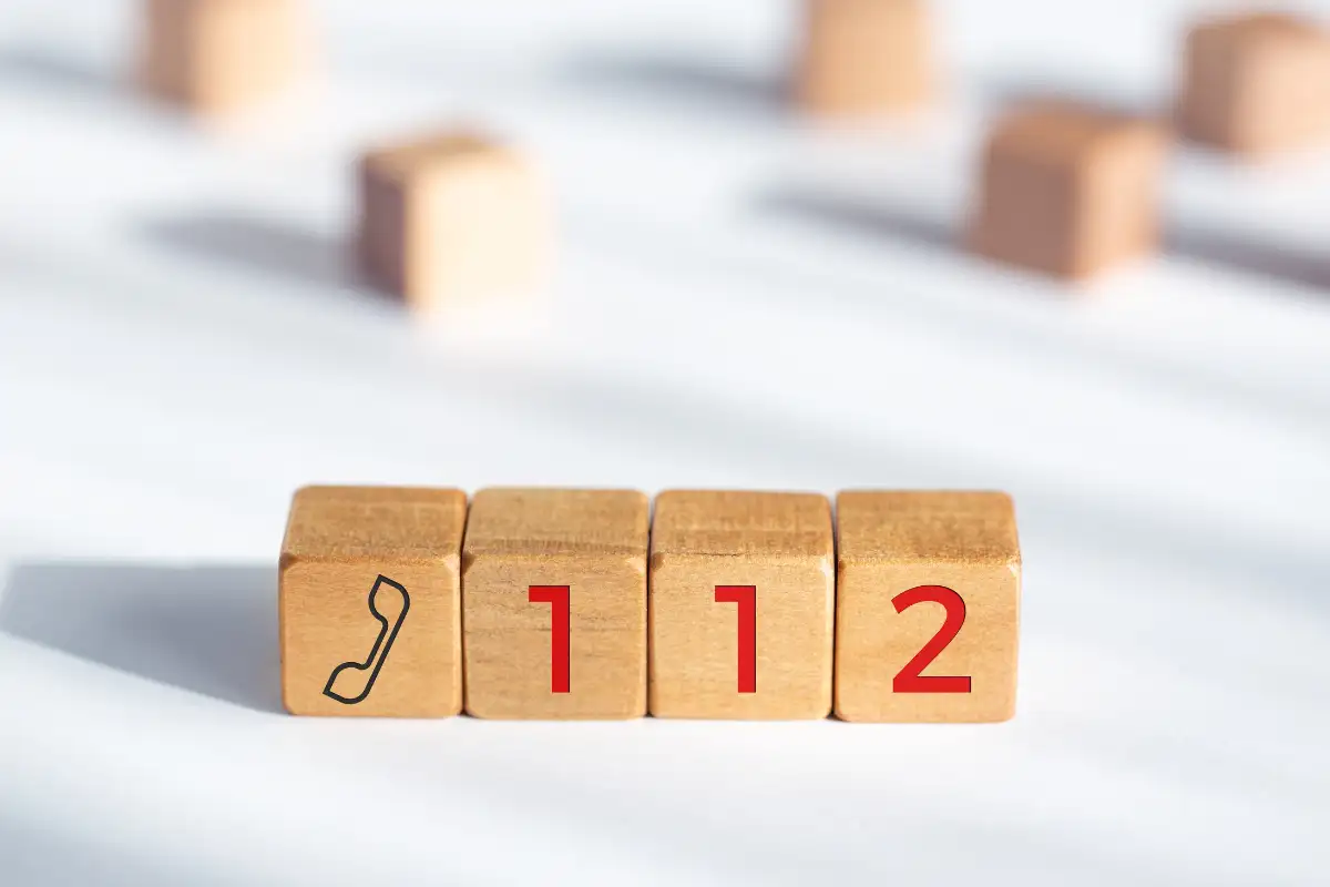 Wooden blocks spelling out 112, Spain's emergency telephone number