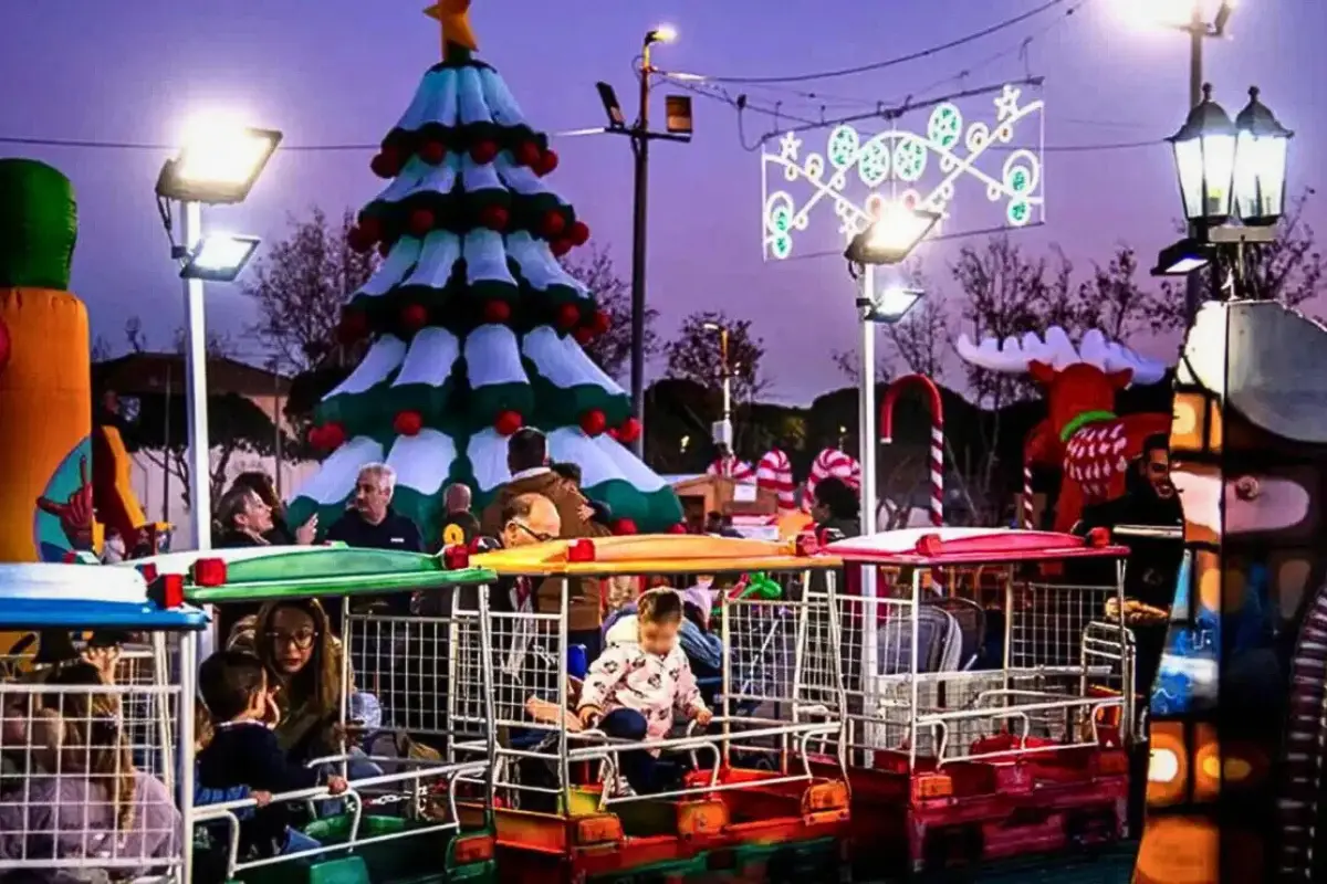 Children riding a miniature train at the Torremolinos Christmas Park