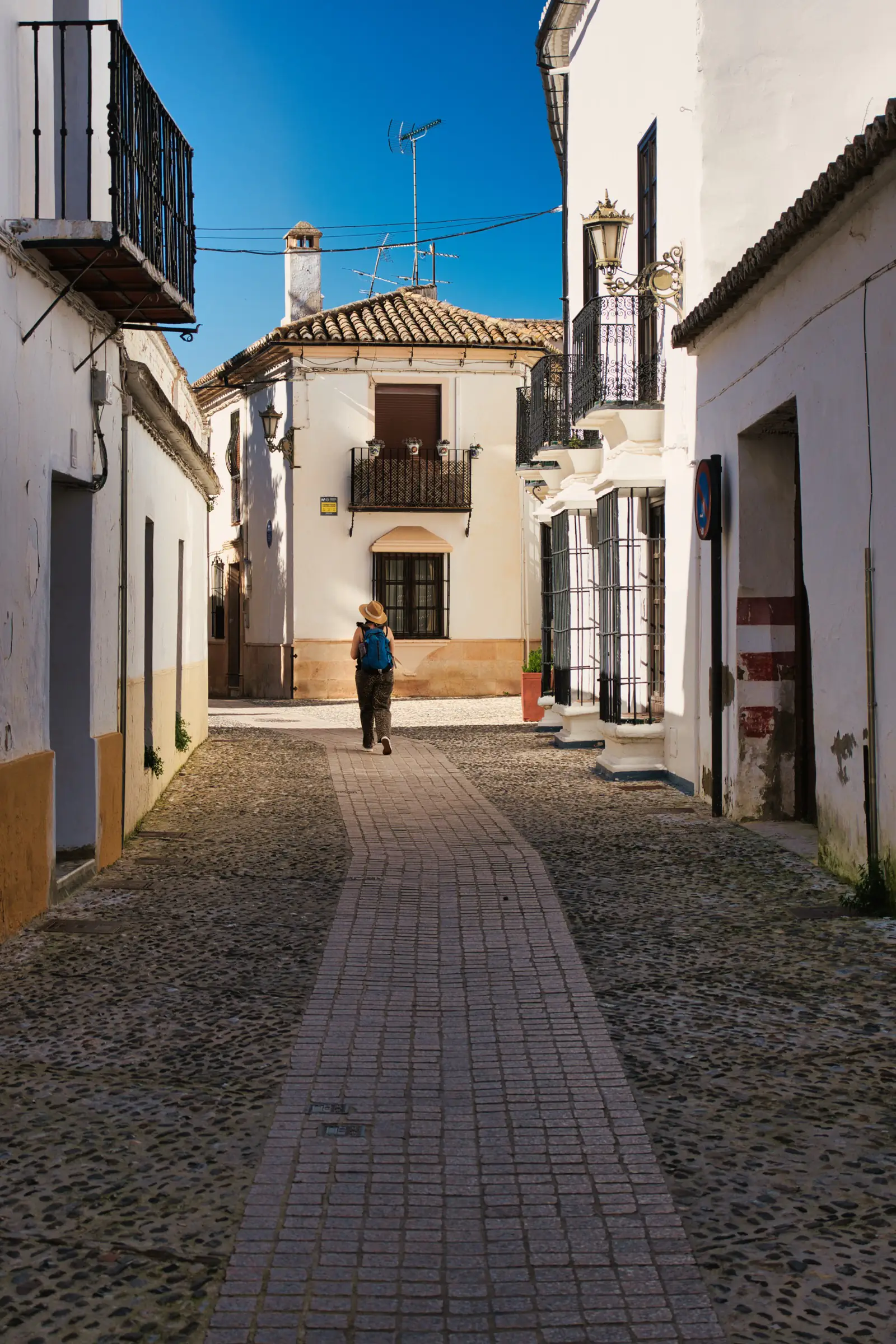 Walking through Ronda's whitewashed Moorish quarter.