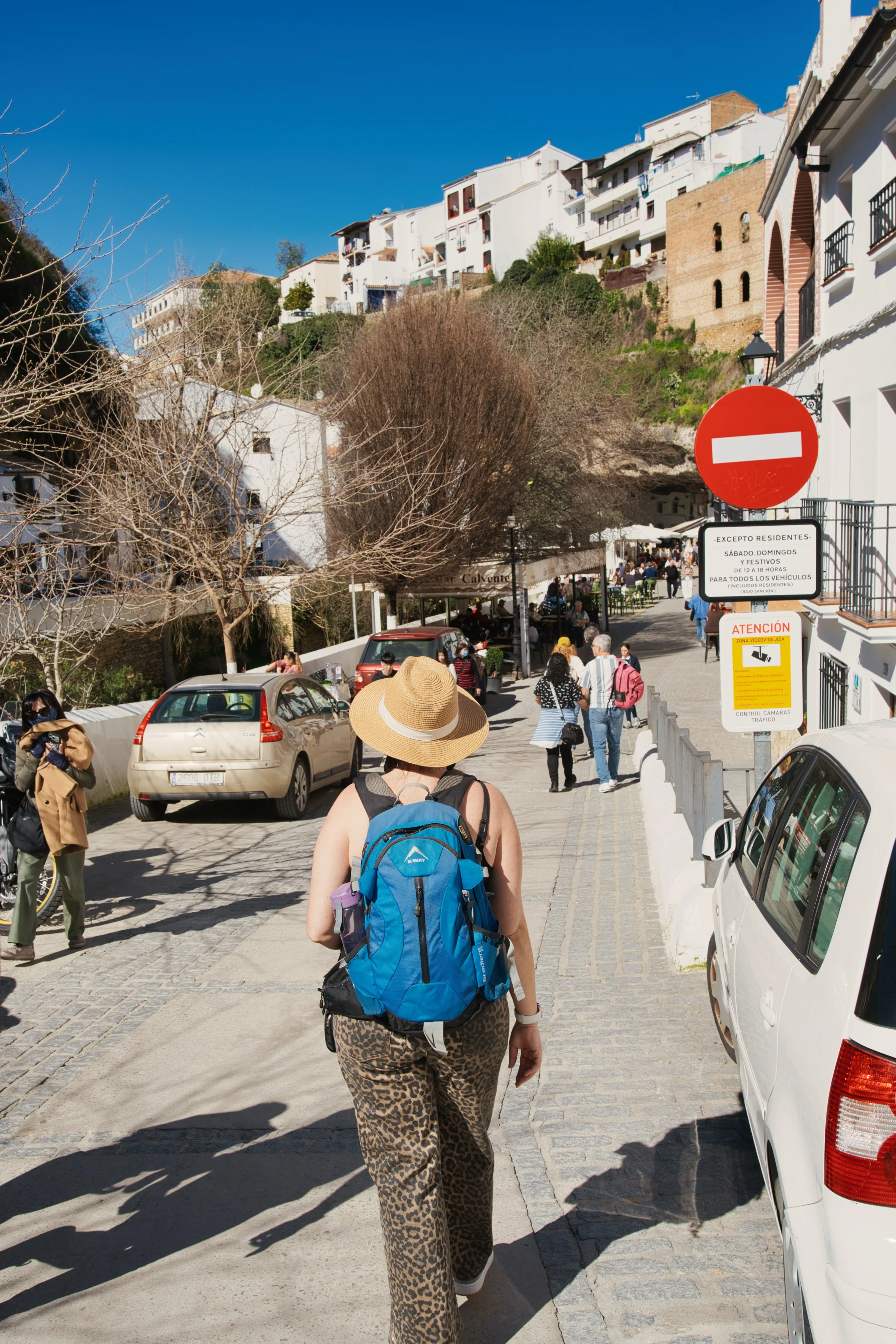 woman walking down a road.