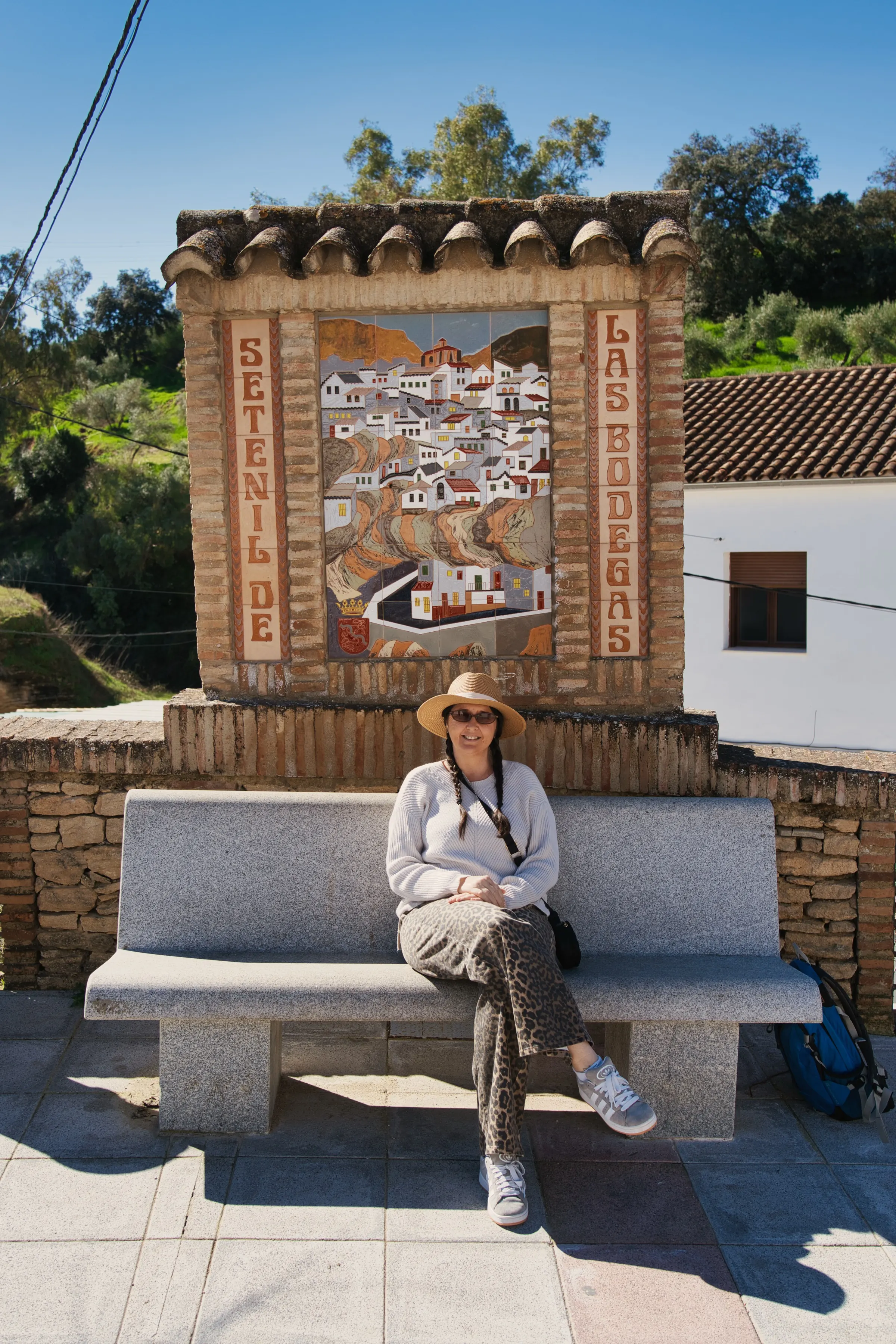 A woman sitting on a bench.