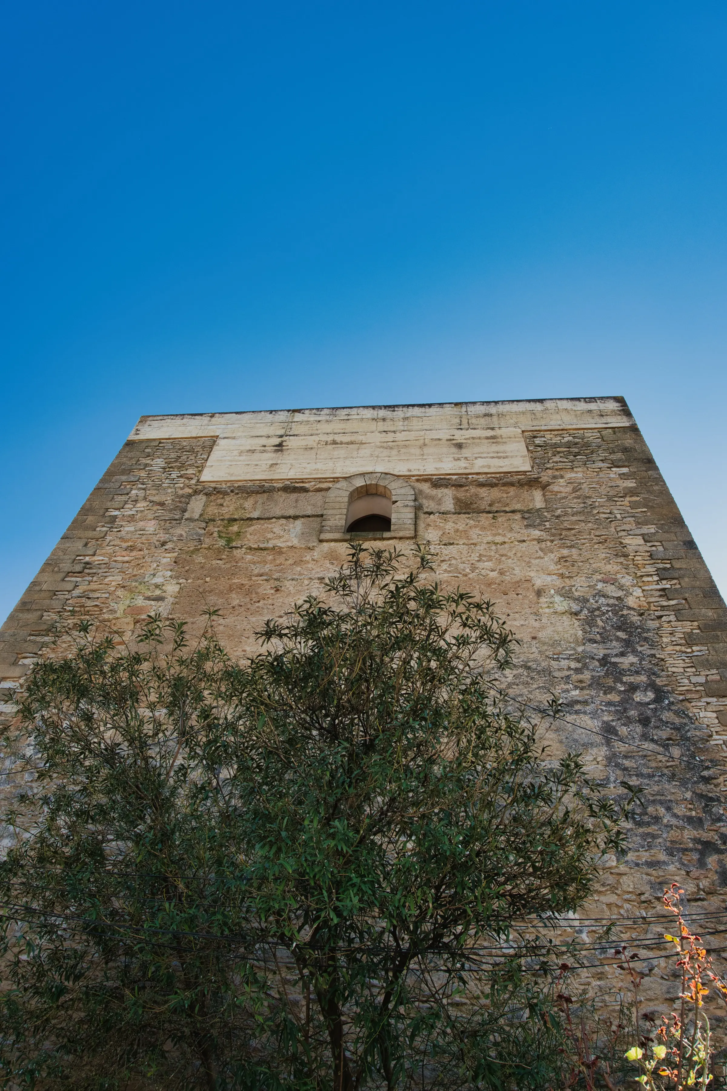 A stone building with blue sky background.